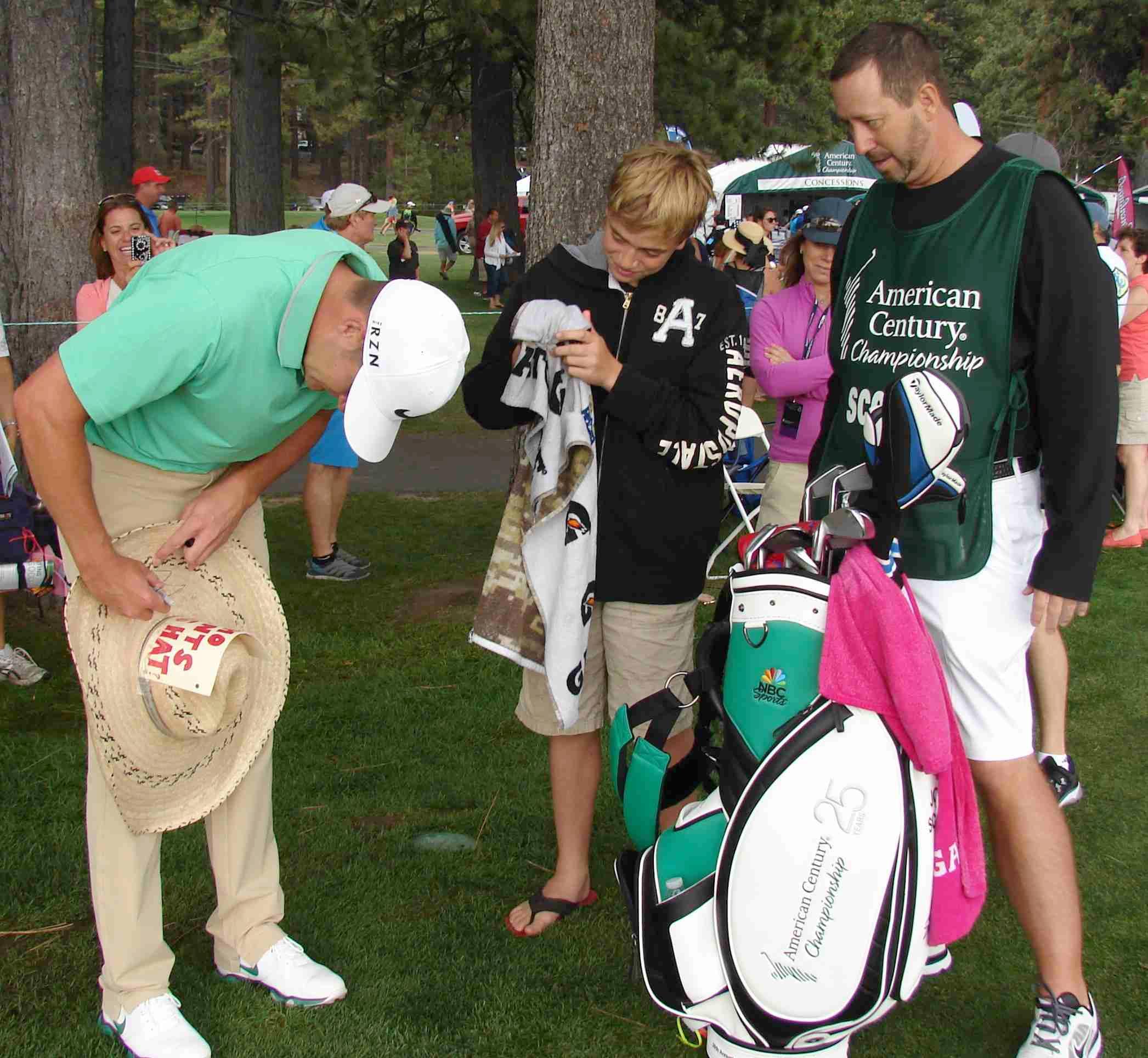 Autographing the hat